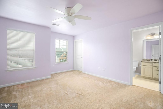 6056 Greenspring Rd, Fredericksburg, VA 22407 - unfurnished bedroom with light carpet, baseboards, ensuite bath, a sink, and ceiling fan
