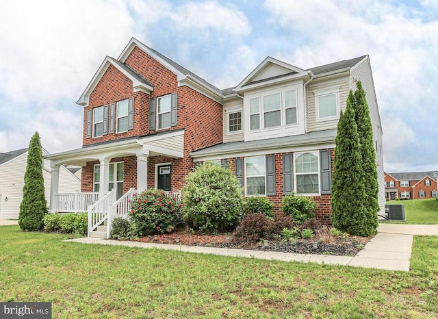 6056 Greenspring Rd, Fredericksburg, VA 22407 - traditional-style house with brick siding, covered porch, and a front lawn