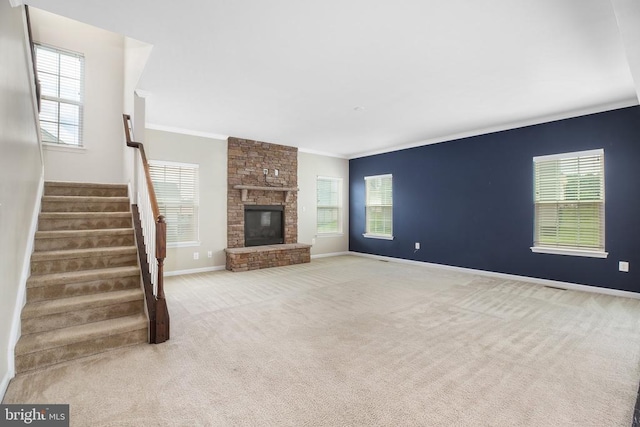 6056 Greenspring Rd, Fredericksburg, VA 22407 - unfurnished living room with ornamental molding, baseboards, stairs, carpet flooring, and a fireplace