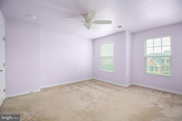 6056 Greenspring Rd, Fredericksburg, VA 22407 - carpeted empty room with healthy amount of natural light, baseboards, ceiling fan, and a smoke detector