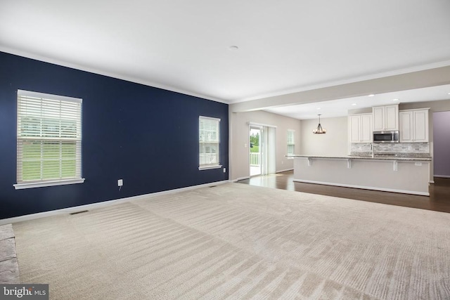 6056 Greenspring Rd, Fredericksburg, VA 22407 - living room featuring ornamental molding, baseboards, recessed lighting, dark colored carpet, and a chandelier