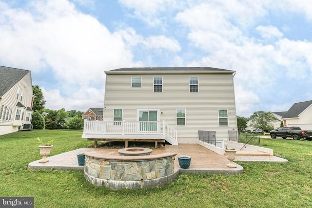 6056 Greenspring Rd, Fredericksburg, VA 22407 - rear view of house with an outdoor fire pit, a deck, a patio, and a lawn