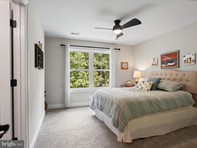 bedroom with carpet flooring, baseboards, and a ceiling fan