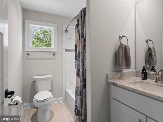 full bathroom featuring toilet, vanity, shower / bath combination with curtain, baseboards, and wood finished floors