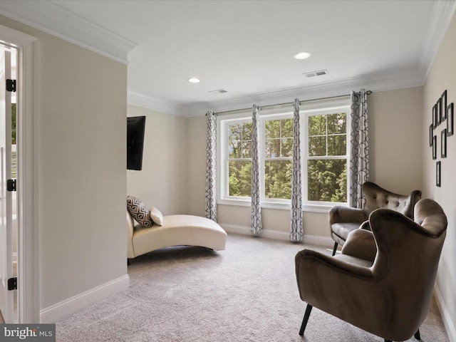 sitting room with baseboards, carpet flooring, crown molding, and recessed lighting