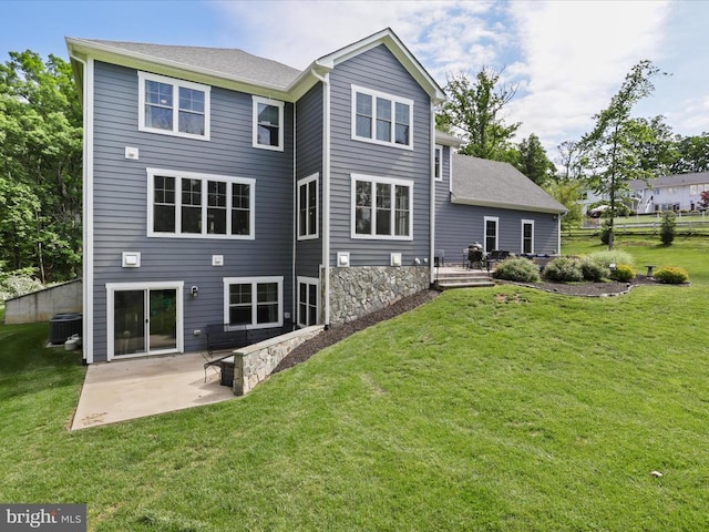 back of house with a patio area, a yard, and central AC unit