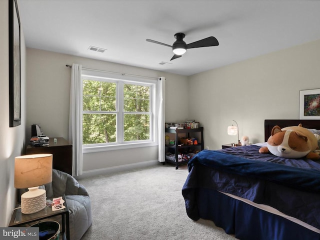 bedroom featuring carpet flooring, baseboards, and a ceiling fan