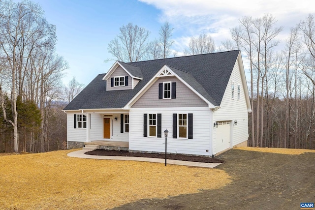 212 Bartholomew Pl, Stanardsville, VA 22973 - cape cod-style house featuring driveway, a garage, a porch, roof with shingles, and a front lawn