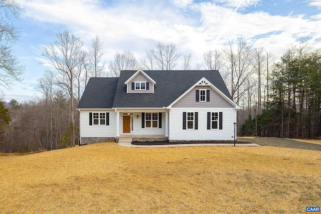 212 Bartholomew Pl, Stanardsville, VA 22973 - cape cod house featuring covered porch and a front yard