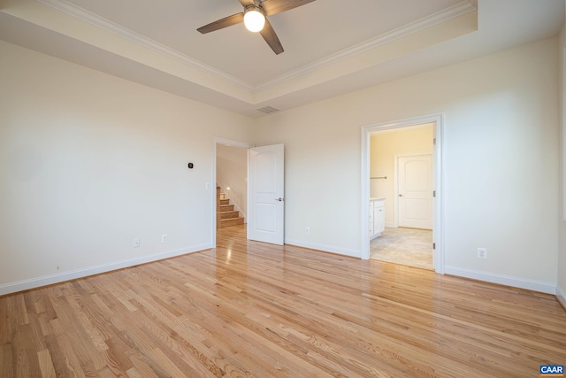 212 Bartholomew Pl, Stanardsville, VA 22973 - unfurnished bedroom with crown molding, light wood-style floors, baseboards, and a raised ceiling