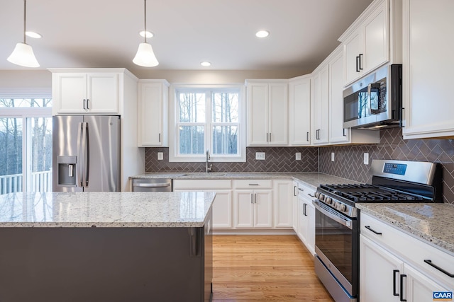212 Bartholomew Pl, Stanardsville, VA 22973 - kitchen featuring white cabinetry, a healthy amount of sunlight, stainless steel appliances, and a sink
