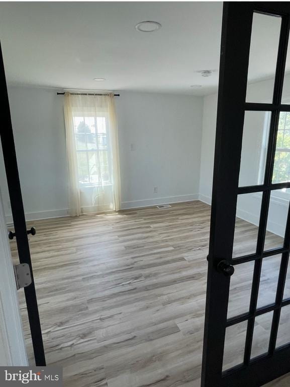 6612 Old Plank Rd, Fredericksburg, VA 22407 - spare room featuring baseboards, plenty of natural light, and light wood-style floors