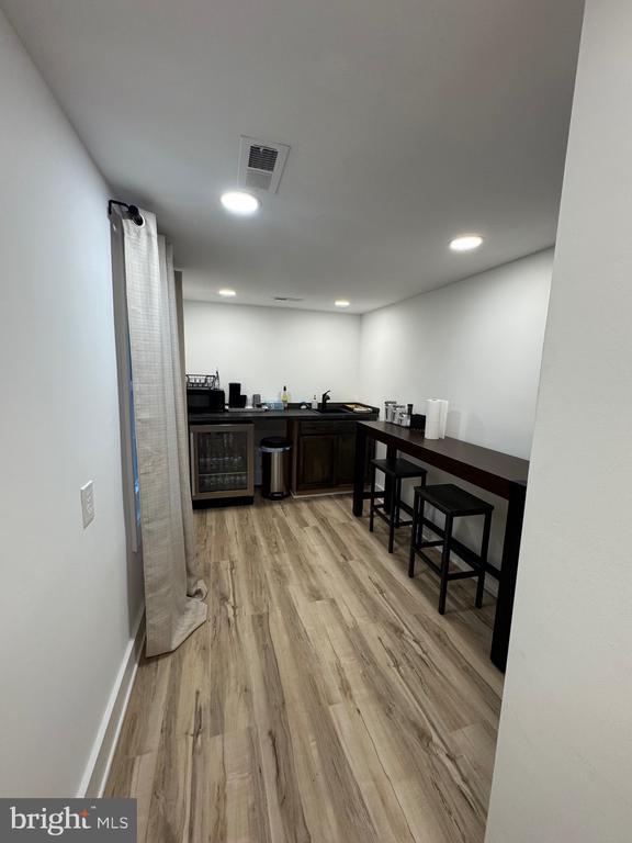6612 Old Plank Rd, Fredericksburg, VA 22407 - bar area featuring beverage cooler, light wood-style floors, and recessed lighting