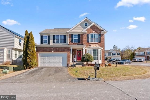 1485 Honor Pl, Locust Grove, VA 22508 - traditional home featuring asphalt driveway, brick siding, an attached garage, and a front lawn