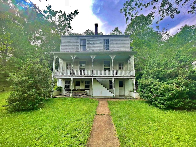 9264 Schuyler Rd, Schuyler, VA 22969 - view of front facade featuring stairs, a front yard, a wooden deck, and a patio
