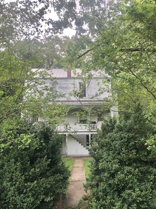 9264 Schuyler Rd, Schuyler, VA 22969 - view of front of house with stairway, a chimney, and covered porch