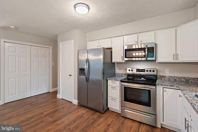 11248 Saint Pauls Rd, Remington, VA 22734 - kitchen with appliances with stainless steel finishes, dark wood finished floors, white cabinets, a textured ceiling, and light stone counters
