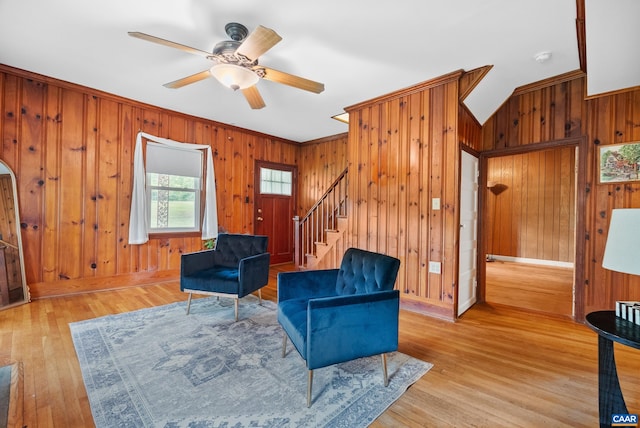 687 Gidsville Rd, Amherst, VA 24521 - living room featuring wooden walls, stairway, light wood-style flooring, a ceiling fan, and baseboards
