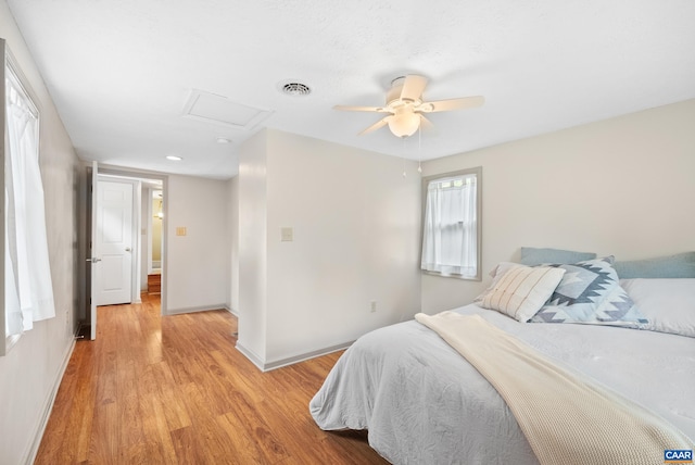 687 Gidsville Rd, Amherst, VA 24521 - bedroom with attic access, light wood-type flooring, baseboards, and ceiling fan