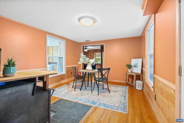 687 Gidsville Rd, Amherst, VA 24521 - dining space with wood finished floors, wainscoting, independent washer and dryer, wood walls, and ceiling fan