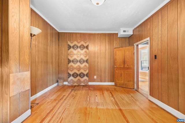 687 Gidsville Rd, Amherst, VA 24521 - spare room featuring wood-type flooring, crown molding, wood walls, and baseboards