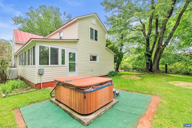 687 Gidsville Rd, Amherst, VA 24521 - back of property featuring a hot tub, a lawn, and metal roof