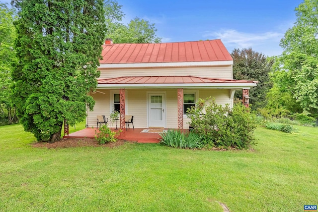 687 Gidsville Rd, Amherst, VA 24521 - farmhouse-style home with a standing seam roof, metal roof, a porch, and a front yard