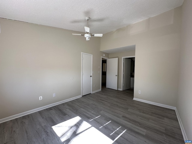 111 Turtle Creek Rd Unit 112, Charlottesville, VA 22901 - spare room with wood finished floors, a textured ceiling, vaulted ceiling, a ceiling fan, and baseboards