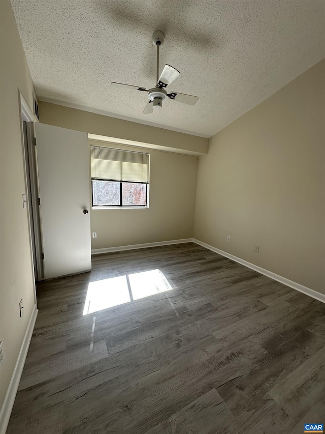111 Turtle Creek Rd Unit 112, Charlottesville, VA 22901 - spare room with ceiling fan, a textured ceiling, baseboards, and dark wood finished floors