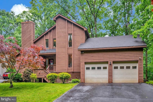 127 Gold Rush Dr, Locust Grove, VA 22508 - view of front of home featuring a chimney, driveway, a front lawn, an attached garage, and a shingled roof