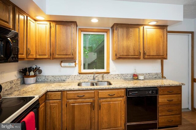 127 Gold Rush Dr, Locust Grove, VA 22508 - kitchen featuring black appliances, a sink, and brown cabinetry