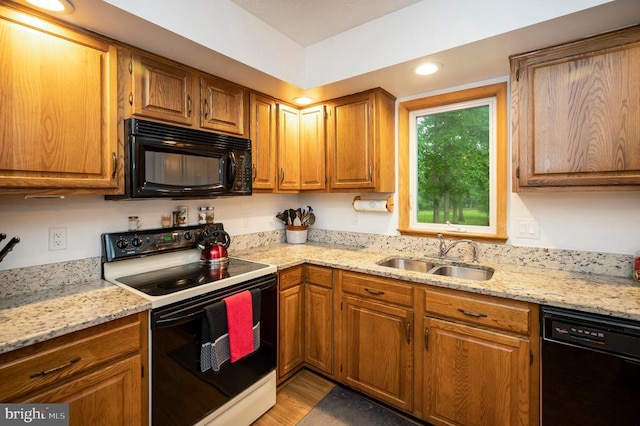 127 Gold Rush Dr, Locust Grove, VA 22508 - kitchen featuring black appliances, a sink, and brown cabinetry