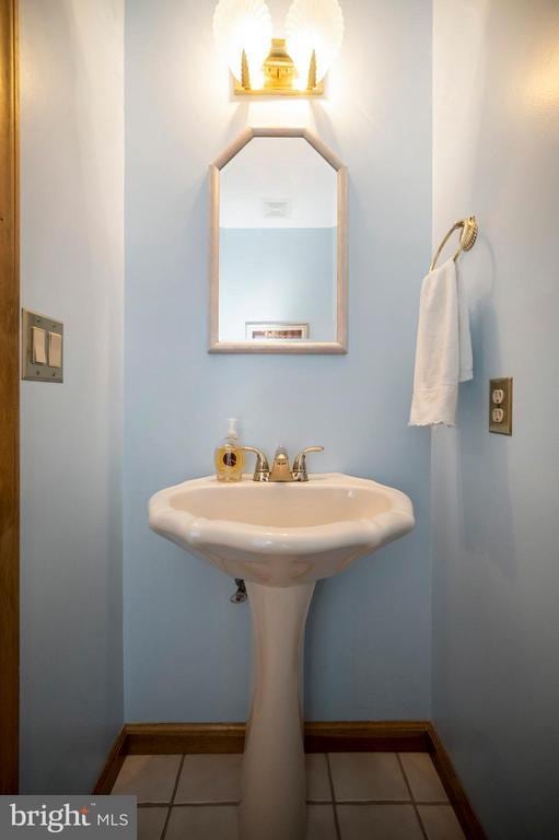 127 Gold Rush Dr, Locust Grove, VA 22508 - bathroom with baseboards and tile patterned flooring