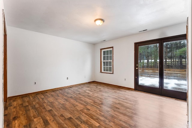 empty room featuring hardwood / wood-style floors