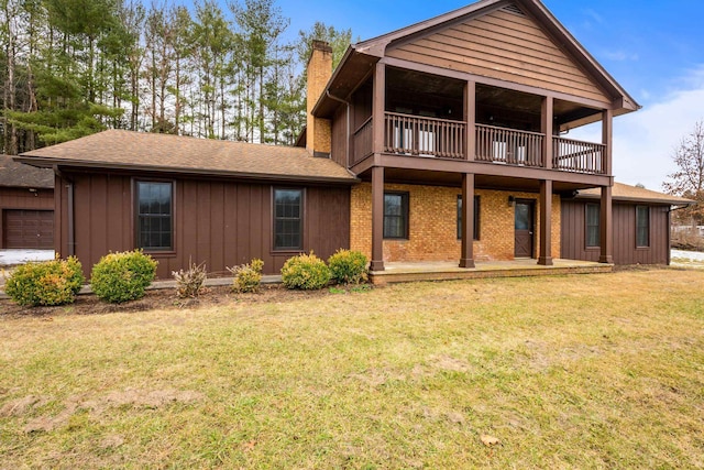 rear view of house with a lawn