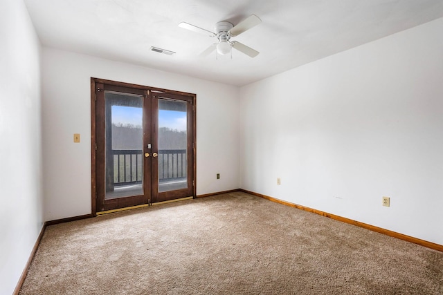 unfurnished room with carpet flooring, ceiling fan, and french doors