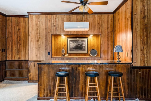 bar featuring wooden walls, carpet, ceiling fan, crown molding, and a wall unit AC