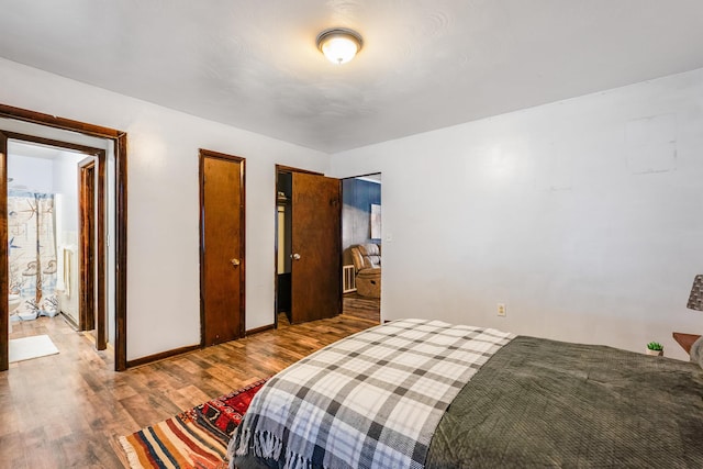 bedroom with hardwood / wood-style floors