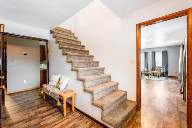 stairway featuring hardwood / wood-style flooring