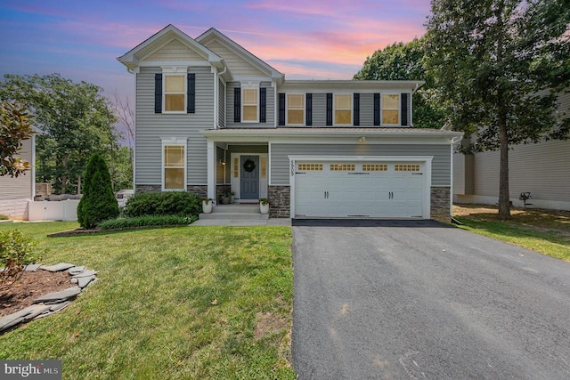 5909 Cambridge Dr, Fredericksburg, VA 22407 - view of front of property featuring stone siding, driveway, and a garage