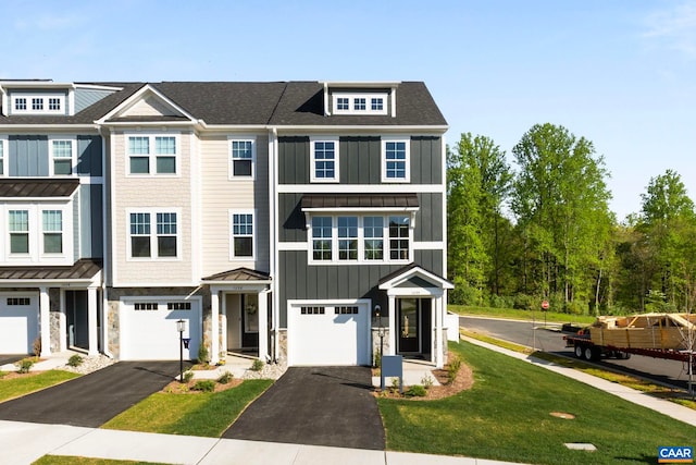 43 Farrow Cir, Charlottesville, VA 22901 - view of property with board and batten siding, driveway, an attached garage, and stone siding
