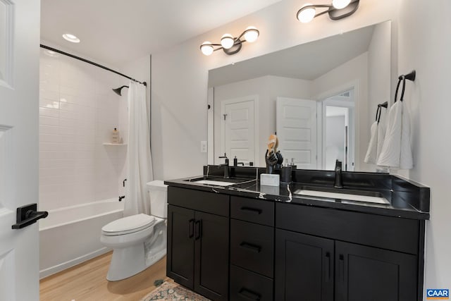 43 Farrow Cir, Charlottesville, VA 22901 - bathroom featuring wood finished floors, toilet, double vanity, and shower / bathtub combination with curtain