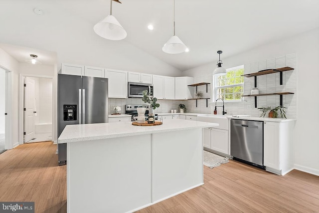 5903 Stubbs Bridge Rd, Mineral, VA 23117 - kitchen featuring stainless steel appliances, open shelves, backsplash, white cabinetry, and decorative light fixtures