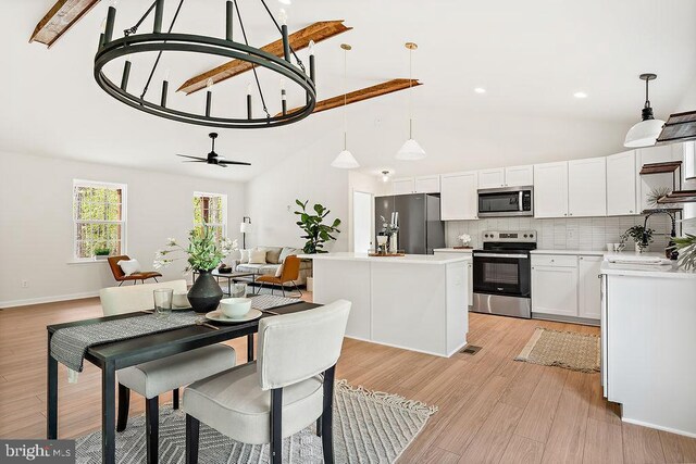 5903 Stubbs Bridge Rd, Mineral, VA 23117 - dining area with light wood-style flooring, ceiling fan, high vaulted ceiling, recessed lighting, and baseboards
