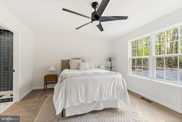 5903 Stubbs Bridge Rd, Mineral, VA 23117 - carpeted bedroom featuring multiple windows, baseboards, and ceiling fan