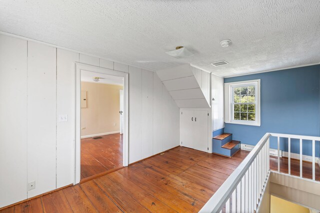 887 Natural Chimneys Rd, Mount Solon, VA 22843 - unfurnished bedroom featuring a textured ceiling and hardwood / wood-style flooring