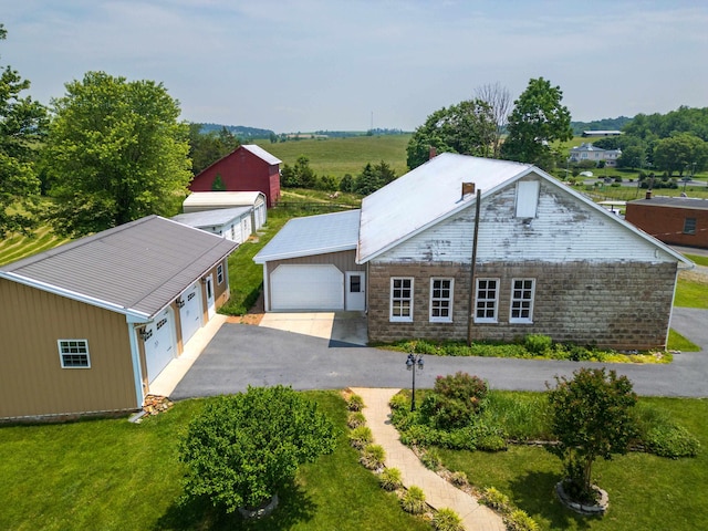 887 Natural Chimneys Rd, Mount Solon, VA 22843 - view of front of property featuring asphalt driveway, stone siding, a garage, and a front yard