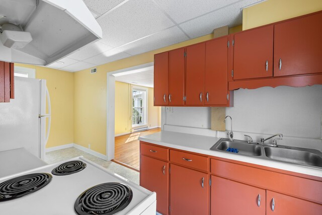 887 Natural Chimneys Rd, Mount Solon, VA 22843 - kitchen featuring freestanding refrigerator, stove, light countertops, red cabinetry, and a drop ceiling