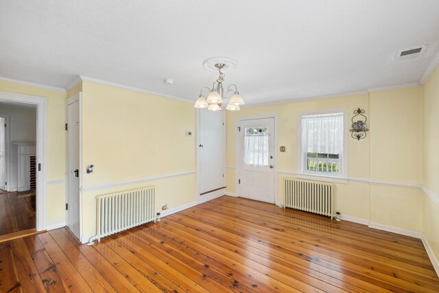 887 Natural Chimneys Rd, Mount Solon, VA 22843 - unfurnished dining area with radiator heating unit, wood-type flooring, a chandelier, and ornamental molding