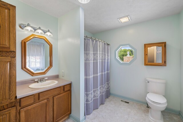887 Natural Chimneys Rd, Mount Solon, VA 22843 - bathroom with toilet, vanity, a shower with shower curtain, baseboards, and tile patterned flooring